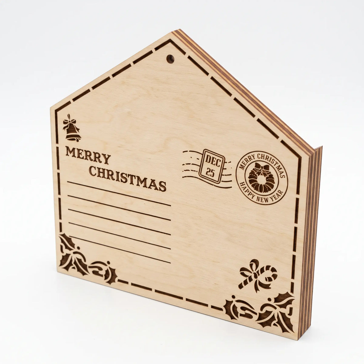Engraved laser cut plywood envelope ornament showing Merry Christmas stamp and address lines on white.