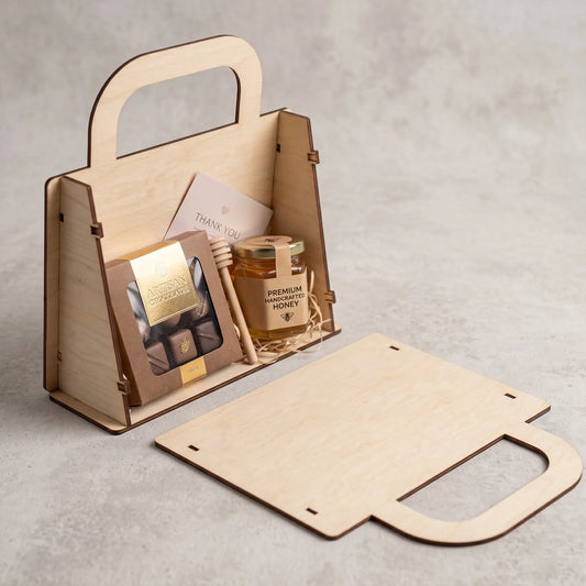 A wooden gift box with a handle, containing a honey jar, chocolate bars, and a card.