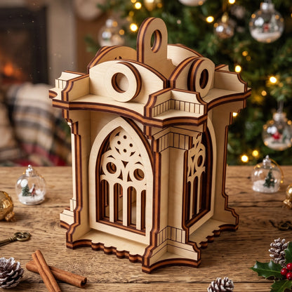 Laser cut plywood Gothic lantern decoration styled on a table with cinnamon sticks, near a blurred Christmas bokeh tree.