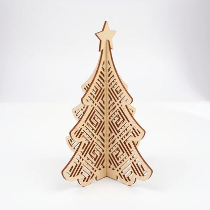 3D laser cut plywood Christmas tree figurine with Greek key maze pattern and star topper standing on plain white surface.