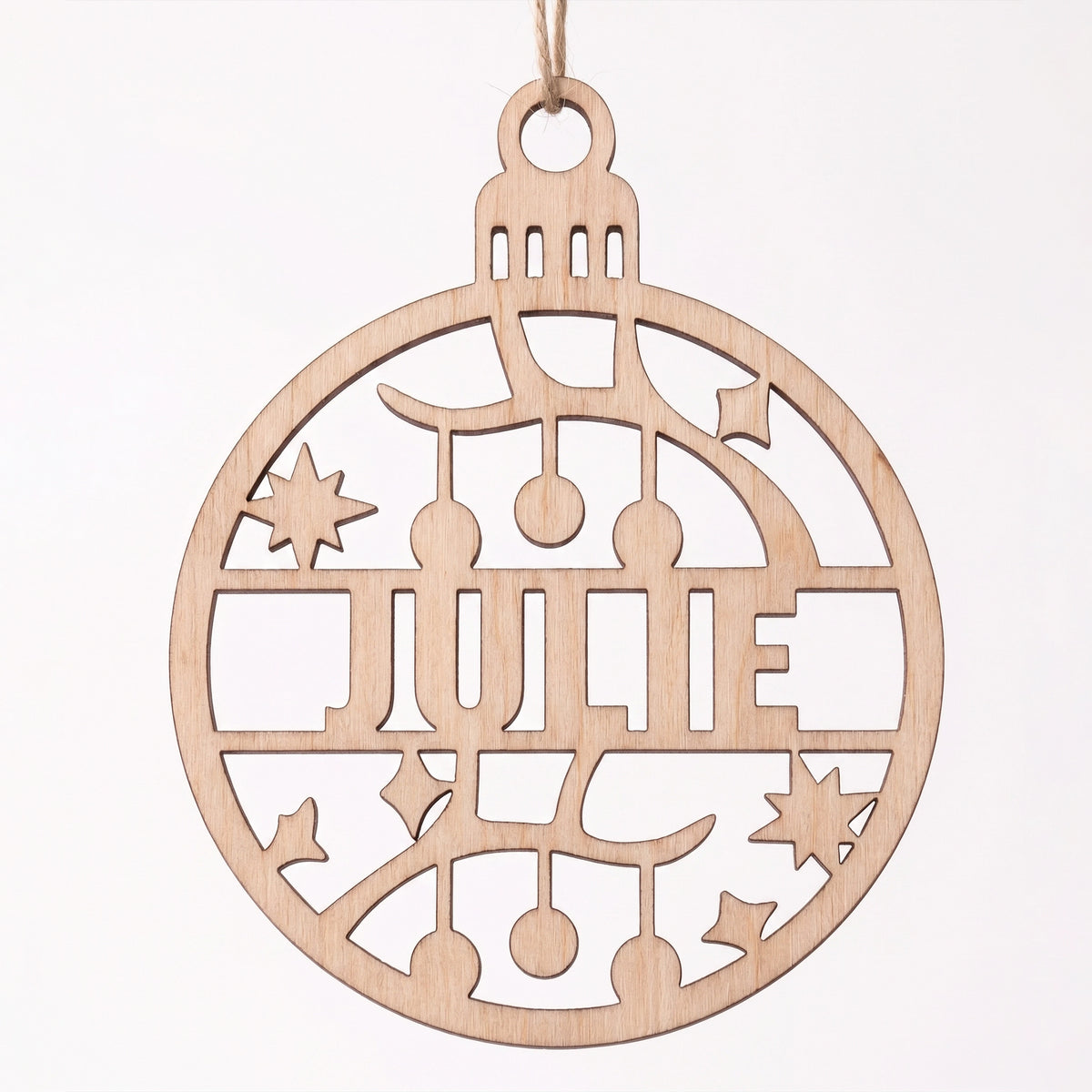 Front view of laser cut plywood Julie name bauble ornament featuring cut out garland and star motifs on white.