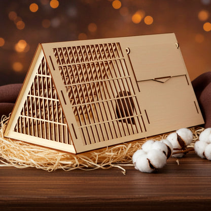 Laser cut wooden plywood Pet Cage or habitat divider, featuring an A-frame triangular roof and detailed slotted ventilation grid on the sides and top. The lightweight plywood structure, designed as a DIY kit, has a small, central access door on the side panel. White background, showing the wood craftsmanship.