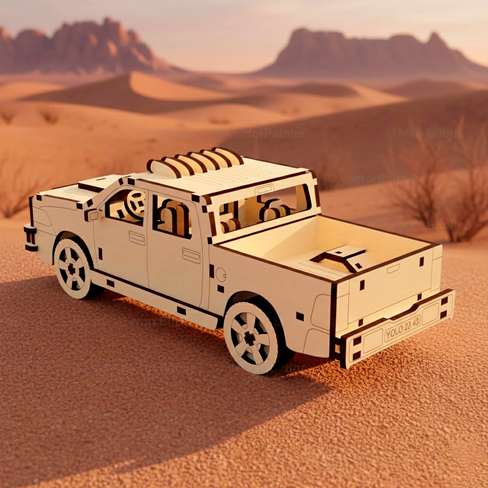 Rear angle of a laser cut wooden plywood pickup truck assembly kit in a desert landscape. The description includes the open cargo bed, detailed interior seats, steering wheel, and realistic tires, showcasing precision wood craftsmanship and design.