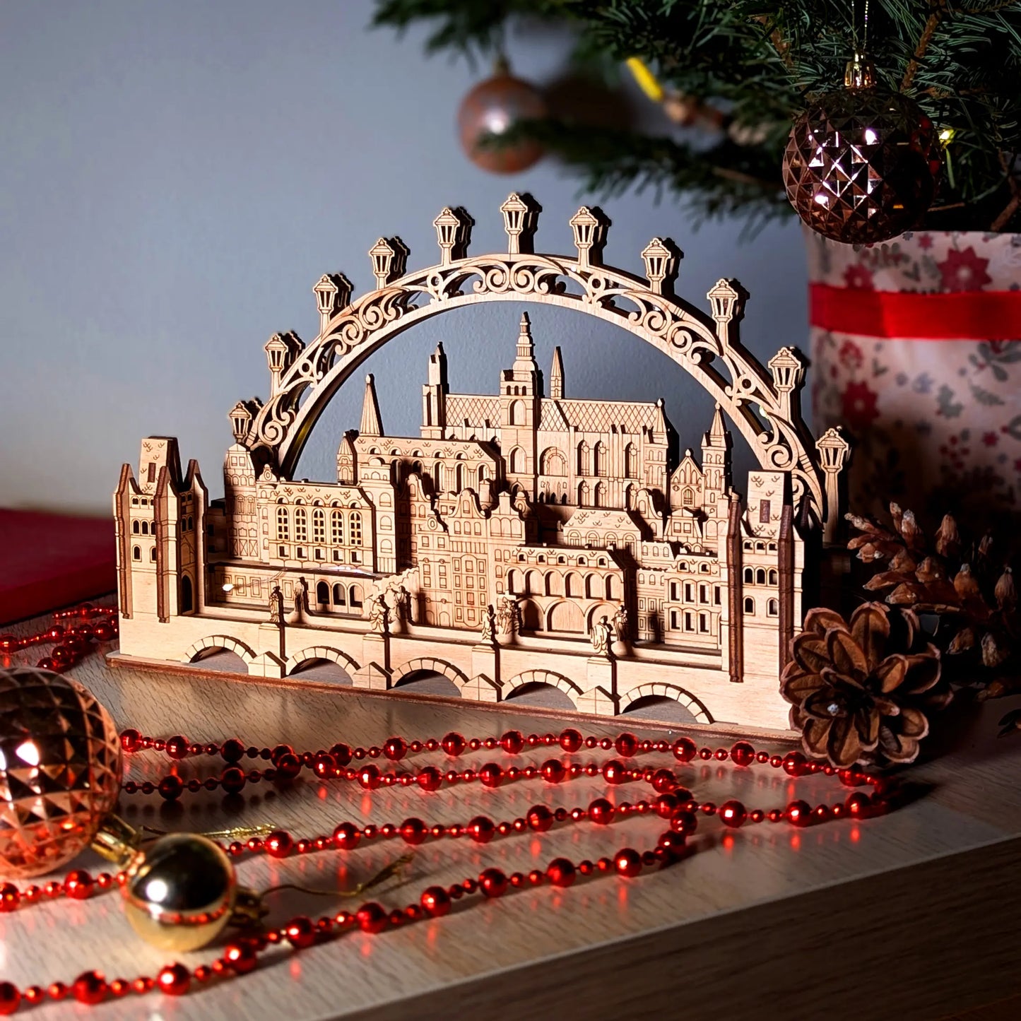 A clear three-quarter view of an assembled 3D Prague historic cityscape centerpiece beautifully made of laser cut plywood.