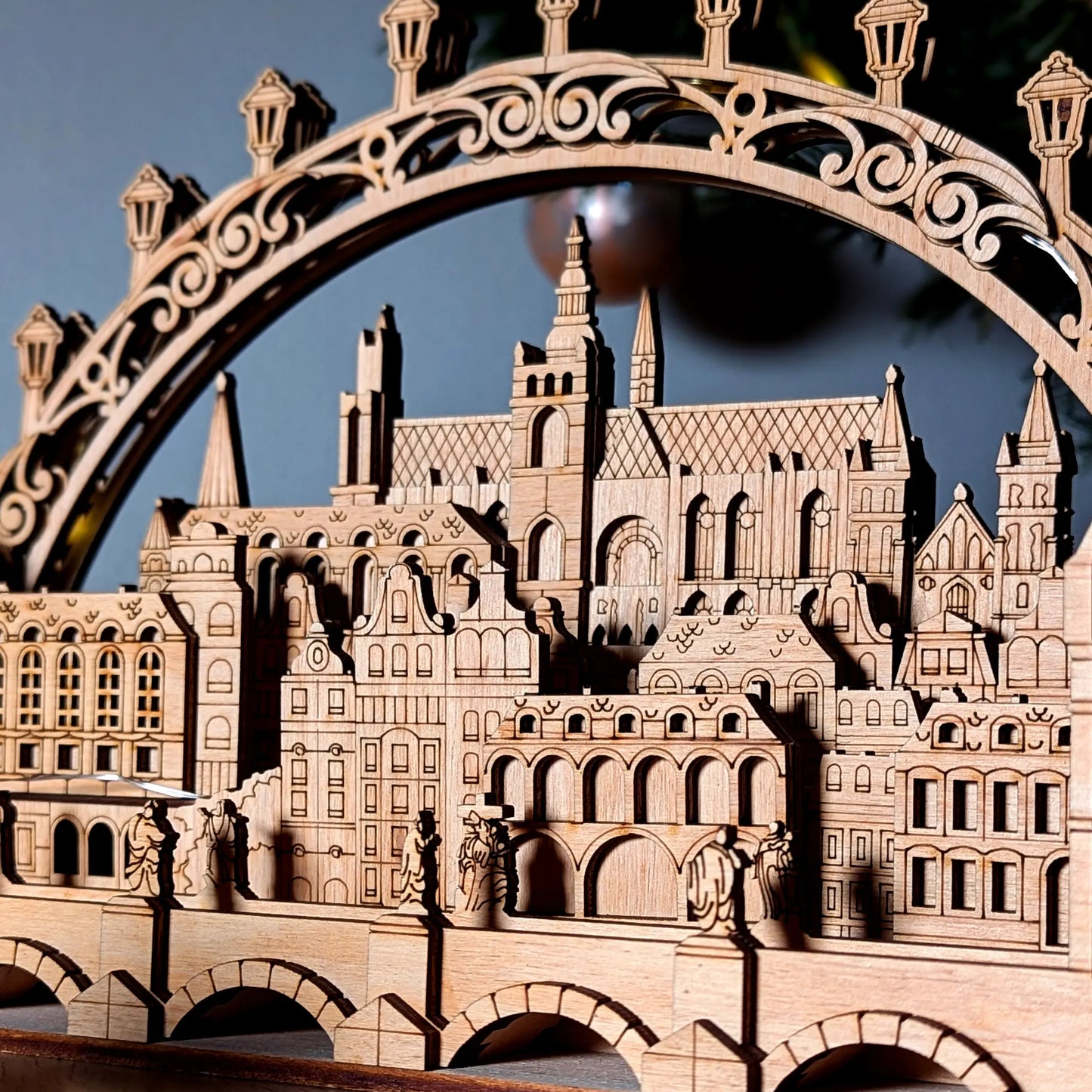A gorgeous right side angled perspective shot of the intricate 3D Prague town light arch crafted from laser cut plywood.
