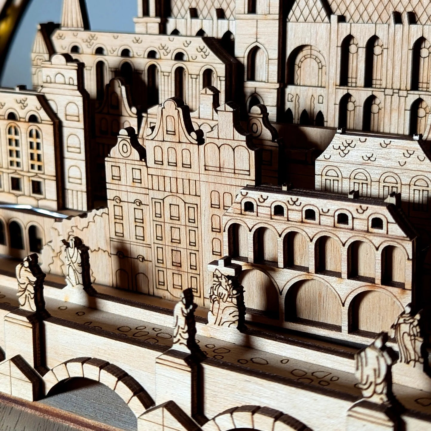 A beautiful low-angle front look at an assembled miniature Prague historic city light arch crafted from laser cut plywood.