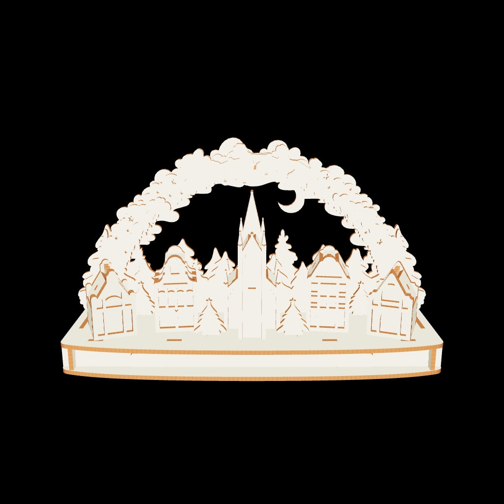 Detailed 3D Christmas town arch with Santa sleigh, houses, and trees made from laser cut plywood on a clear white background.