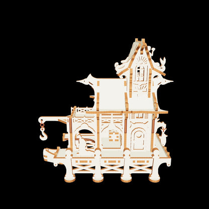 Laser cut plywood sailor house with a tiny fisherman figure, engraved anchor details, and detailed arched windows.