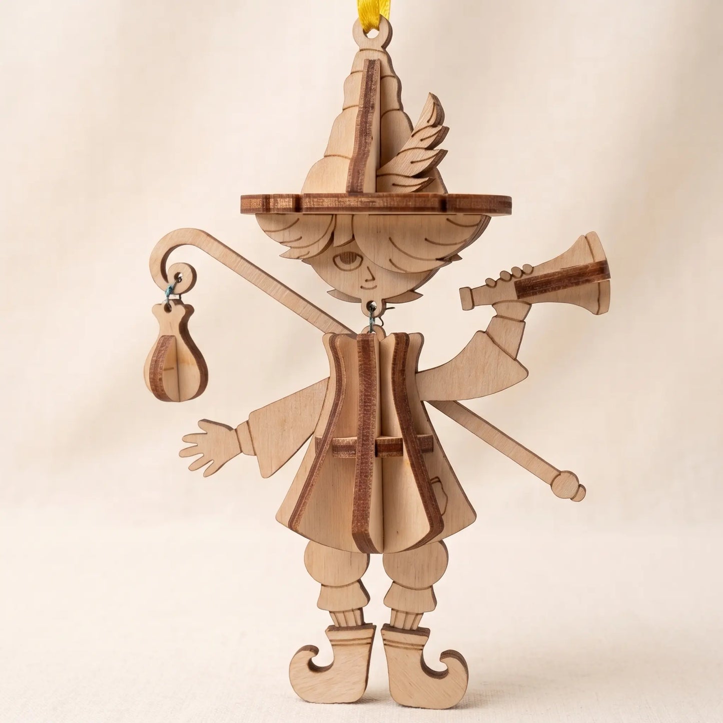 Marionette Puppet Laser Cut File showing an unpainted wooden bard ornament with layered hat, flute, staff, and fantasy character details for nursery or kids room decor.