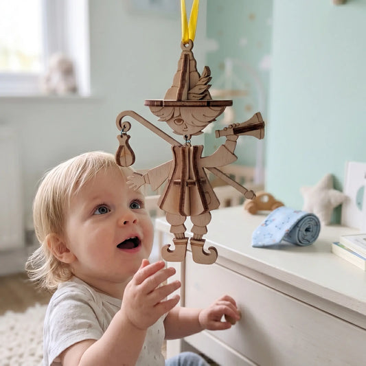 Hanging wooden marionette puppet ornament  and staff displayed near a child in a soft kids room interior.