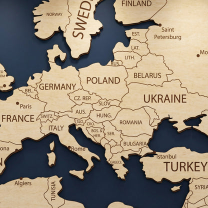 Detailed close-up of Europe and the Middle East on a 3D laser-cut wooden world map. The image showcases precise engravings of countries like Germany, Poland, Ukraine, and Turkey, highlighting the layered wood depth and dark burnt edges.