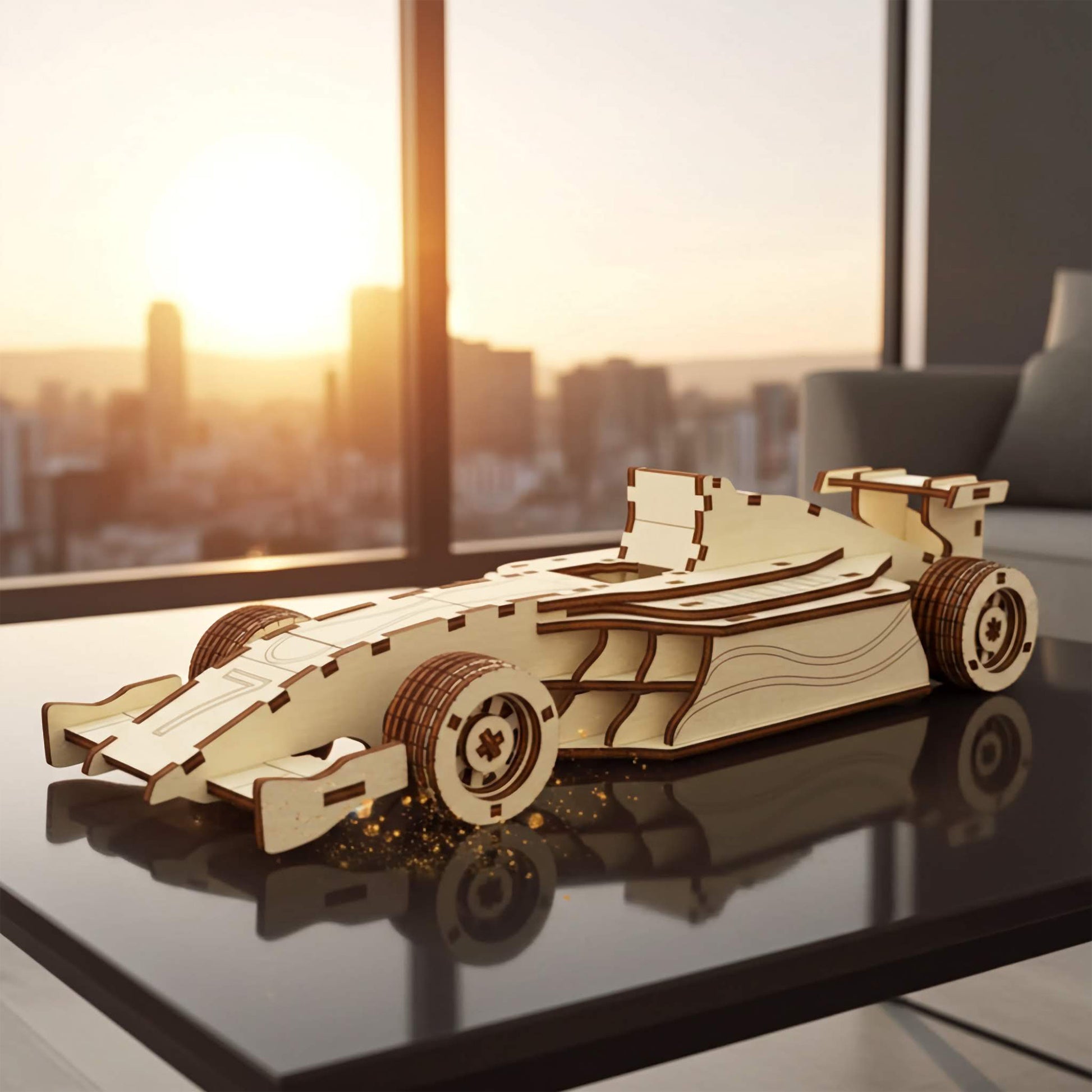 Laser cut wooden plywood formula racing car 3D model on a reflective black table. Detailed plywood assembly showing aerodynamic wings, wide treaded tires, and open cockpit. Urban sunset city skyline through a large window in the background.