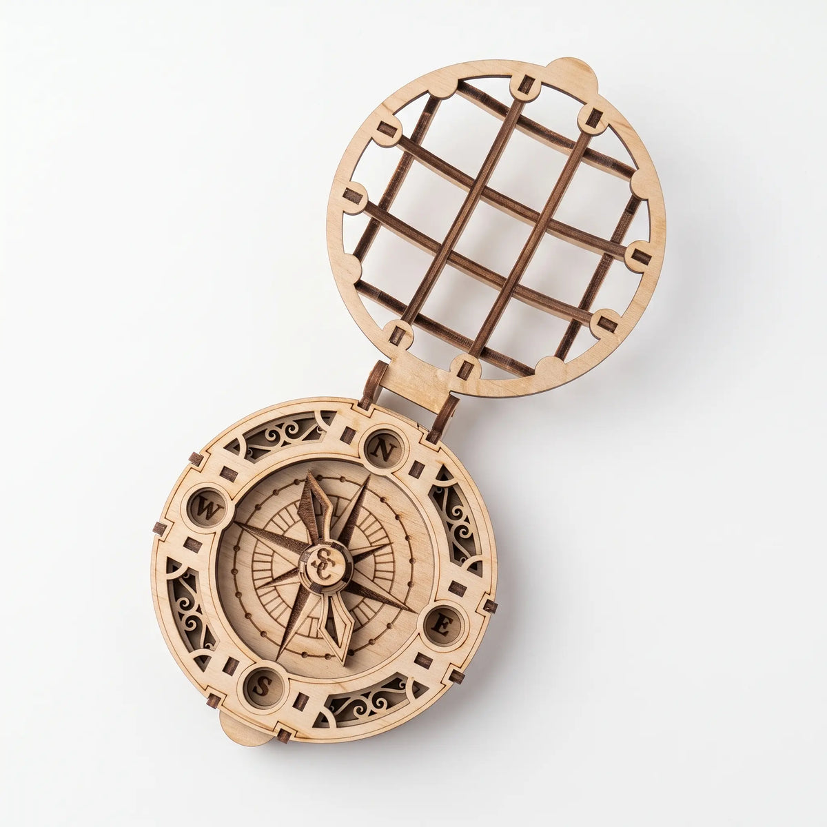 Top view of open laser cut plywood Santa compass with engraved compass rose and cardinal points on white backdrop