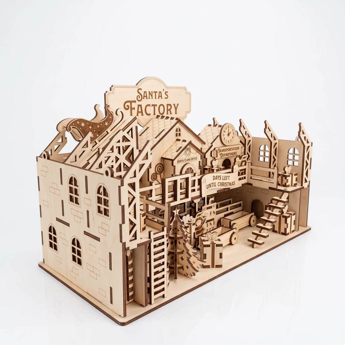 Rear three-quarter view of multi-level laser cut plywood Santa's Factory kit showing wall framework on white