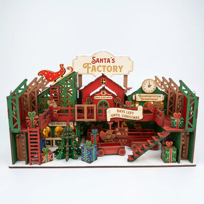 Hand-painted multi-level laser cut plywood Santa's Factory workshop with illuminated lights, sleigh, and gifts