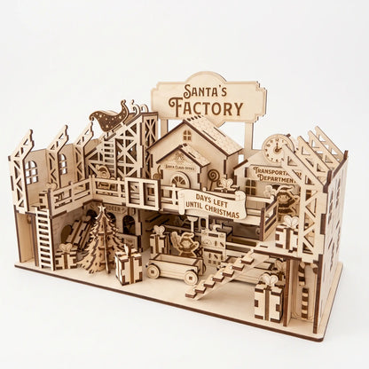 Perspective view of laser cut plywood Santa's Factory diorama featuring offices, sleigh ramp, and stairs on white