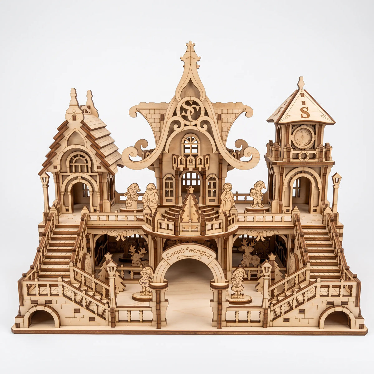 Front direct shot of laser cut plywood Santa workshop with stairs, clock tower, and tiny figurines.