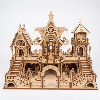 Front direct shot of laser cut plywood Santa workshop with stairs, clock tower, and tiny figurines.