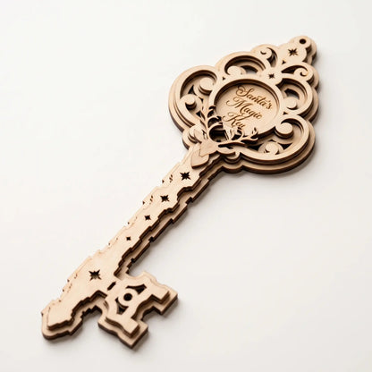 Perspective view of multi-layered laser cut plywood Santa magic key ornament with engraved reindeer on white background.