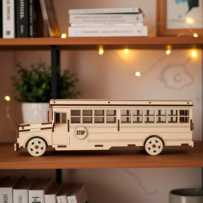 Side profile of a laser cut wooden plywood school bus sitting on a wooden bookshelf. The 3D assembly kit features a side "STOP" sign and multiple window cutouts. Showcases the intricate layers of natural plywood and smooth laser-engraved details.
