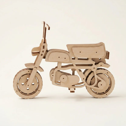 Wooden scooter motorcycle model on a beige background