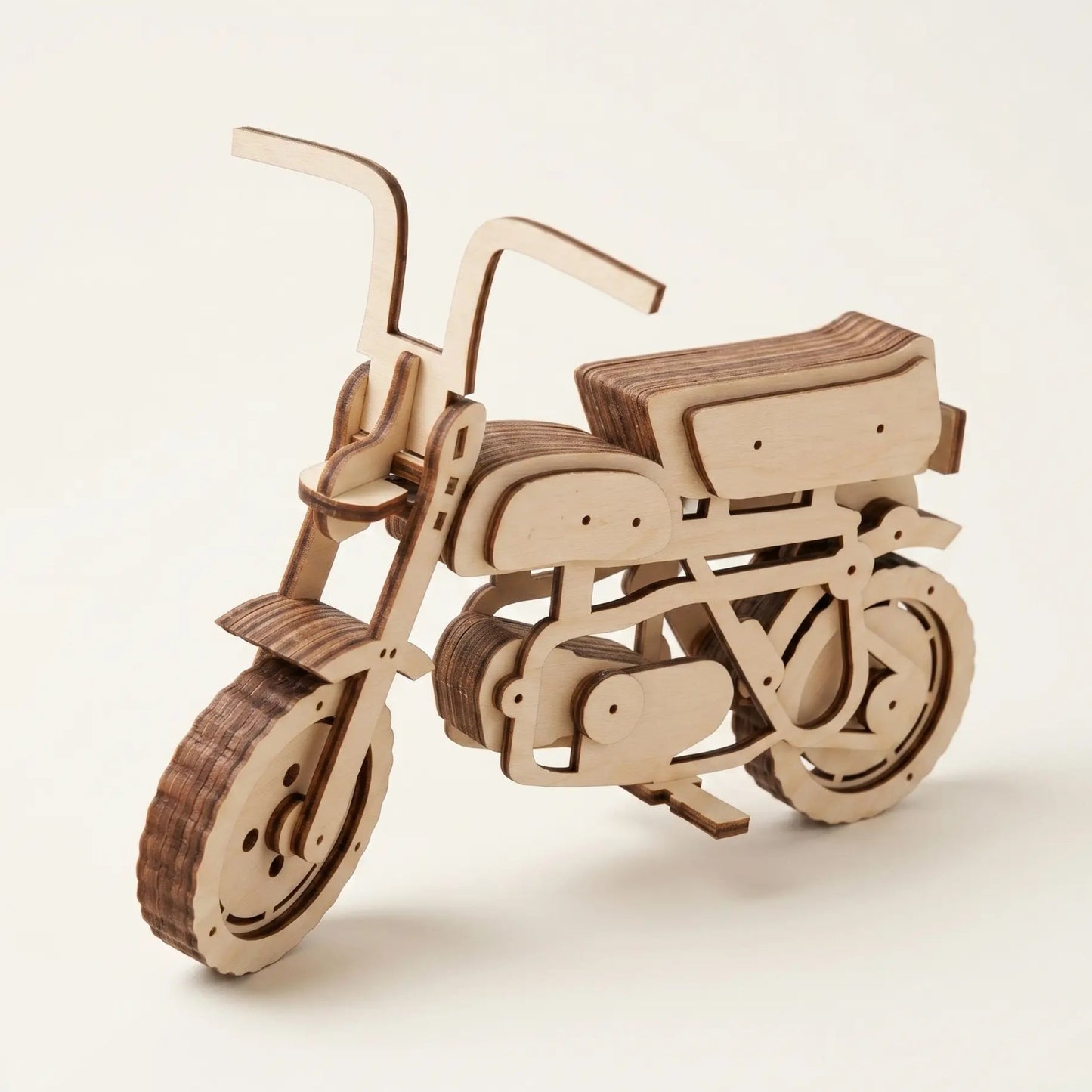 Wooden scooter motorcycle model on a white background