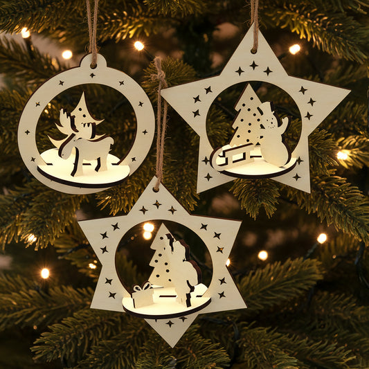 Laser cut wooden Set of 3 Christmas toys featuring layered 3D scenes of a reindeer, snowman with tree and Santa placing gifts inside star and circle frames, displayed against a warm lighted Christmas tree background.