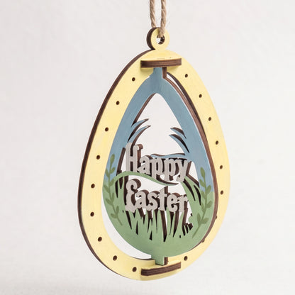 Painted laser cut plywood Easter egg ornament featuring rotating Happy Easter lettering cutout on plain white background.