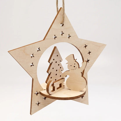Laser cut plywood star bauble ornament with 3D diorama of cheerful snowman and holiday tree on sled.