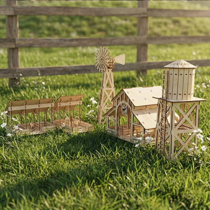 Perspective shot of a laser cut plywood farm set on a lawn. The water tower with its cross-braced stand is in the foreground. The barn, windmill, and stables trail into the background, highlighting the smooth texture of the wood.