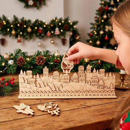 A child is playing with a wooden laser cut plywood advent calendar on a table, surrounded by Christmas decorations and ornaments.