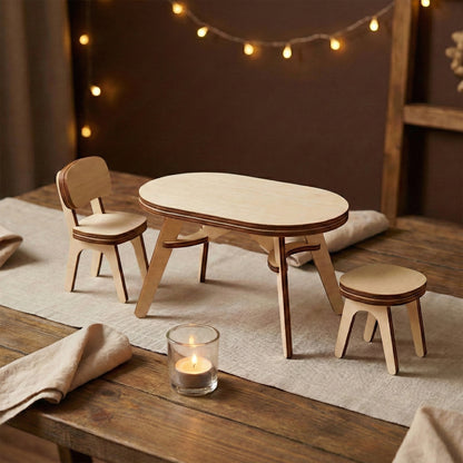 Minimalist dollhouse dining set made of laser cut plywood. Includes an oval table, a chair with a backrest, and a small stool. Arranged on a linen runner with a tea candle, showing the clean birch wood grain and modern curved legs.