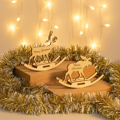 Delicate laser cut Toys of deer and elk for Christmas with standing and rocking moose silhouettes and festive greetings, set against a warm glowing Christmas garland background.