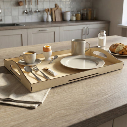Beige laser cut wooden breakfast tray with side handles, presenting a soft-boiled egg, coffee, and cutlery, against a modern kitchen countertop background.