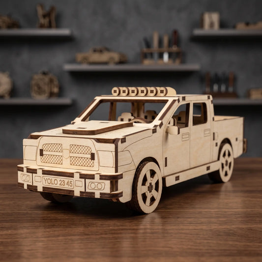 Wooden pickup truck laser cut model standing on wooden surface