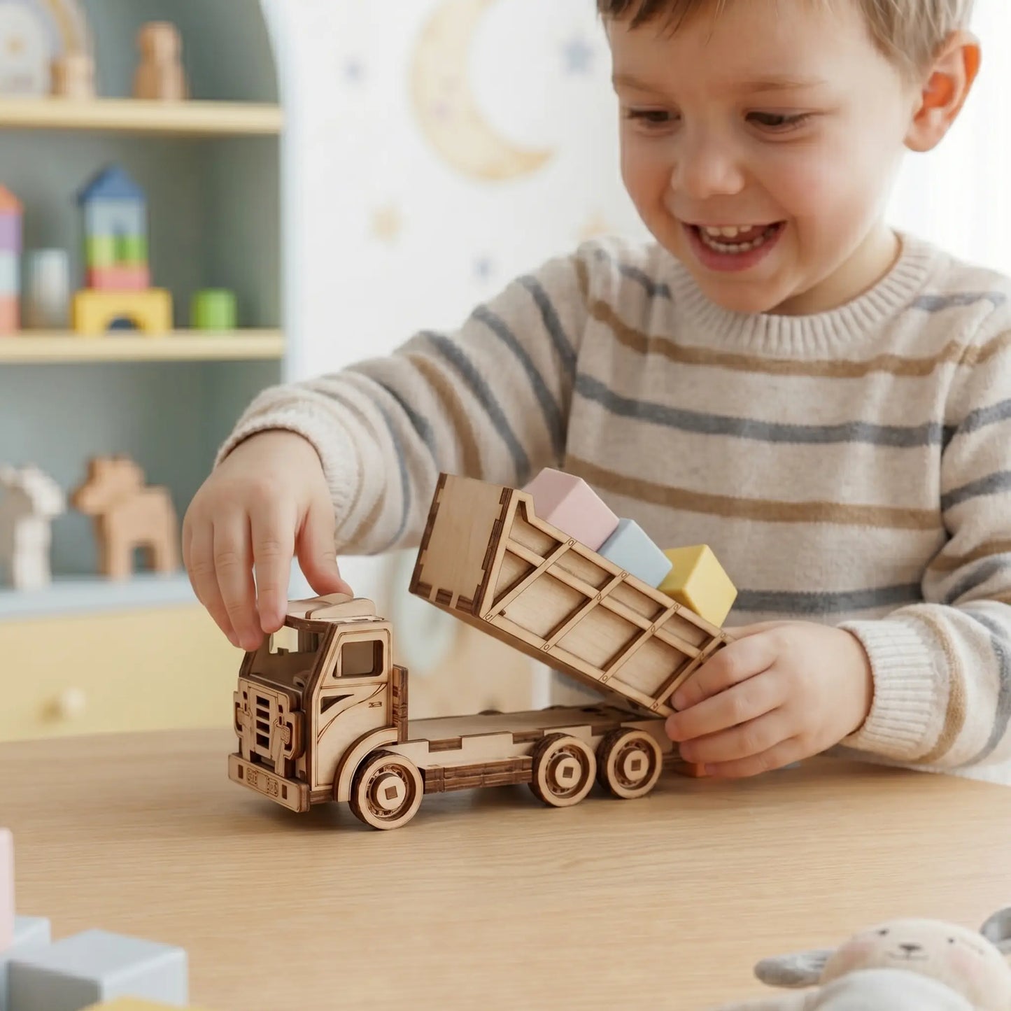Child playing with wooden laser cut toy truck and blocks on a table