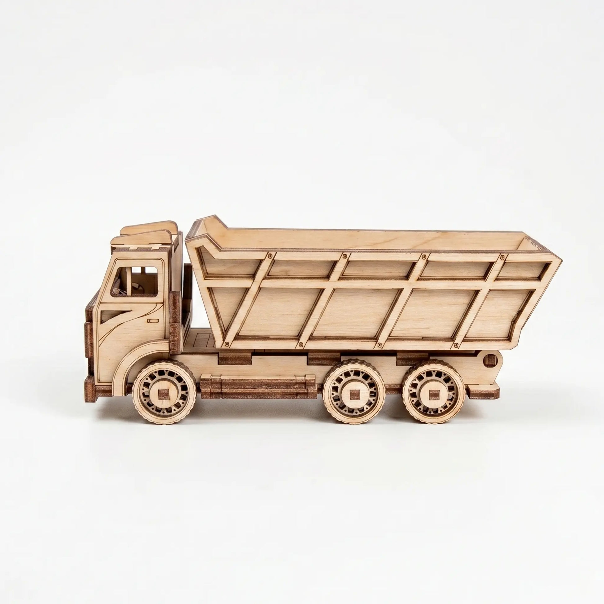 Wooden model of a dump truck on a white background