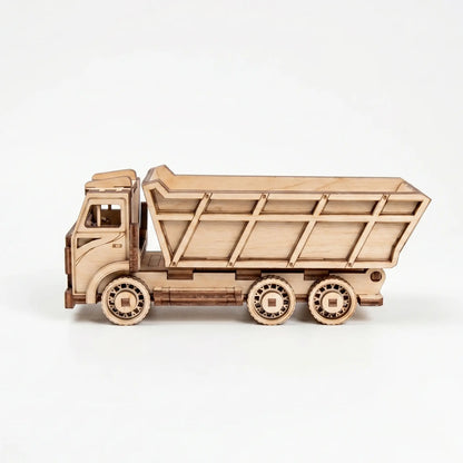 Wooden model of a dump truck on a white background
