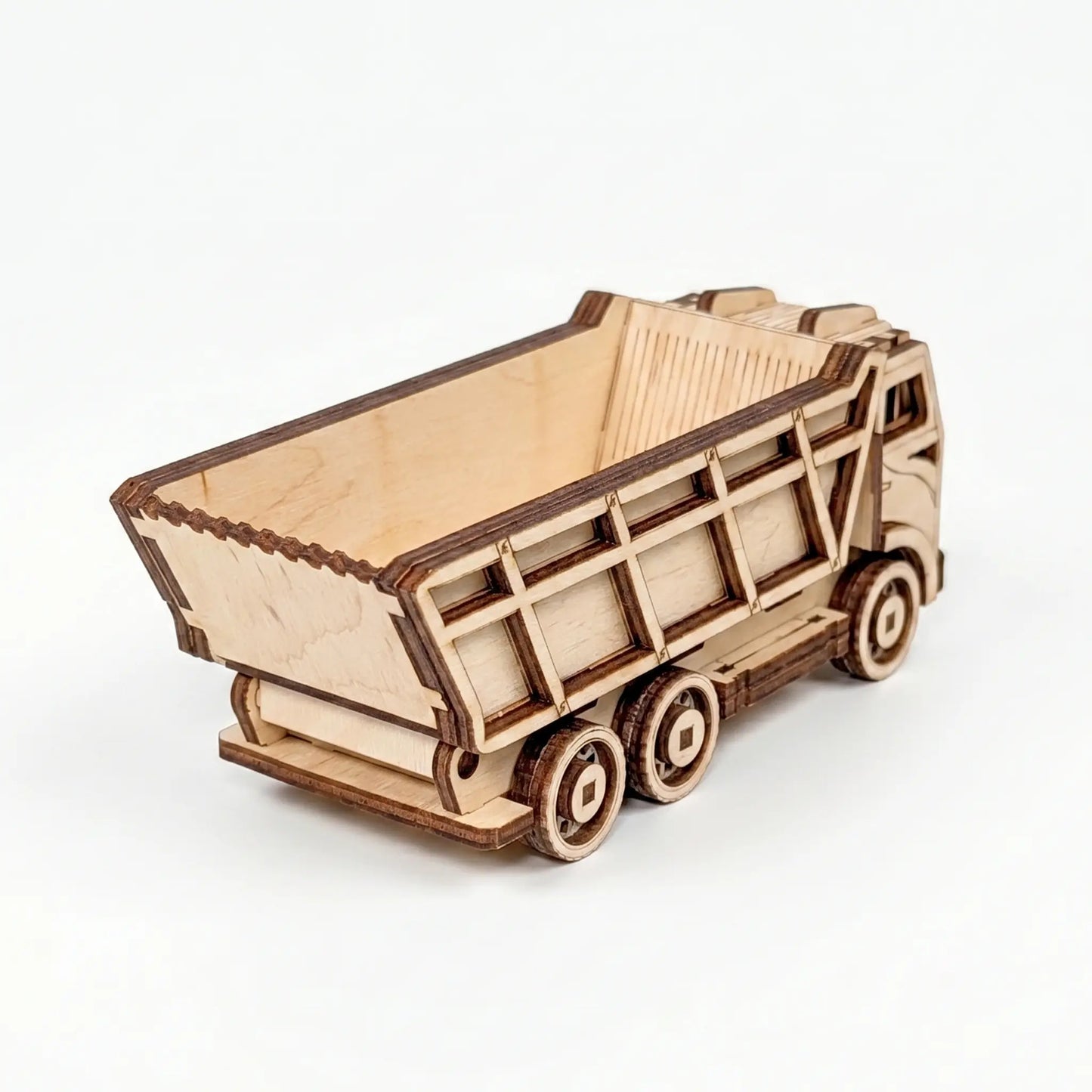 Wooden model of a dump truck on a white background