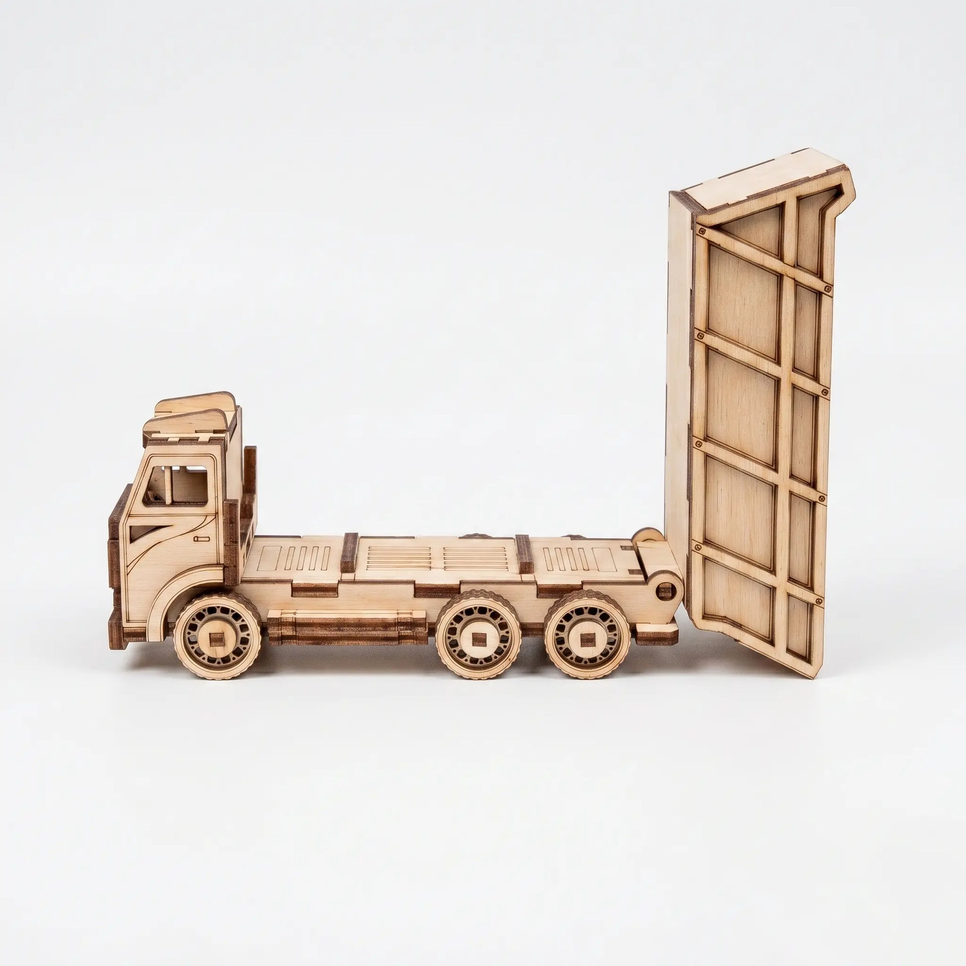 Wooden truck model with an open cargo area on a white background