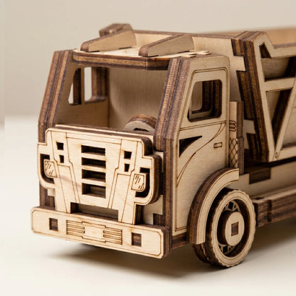 Wooden model of a truck on a light gray background