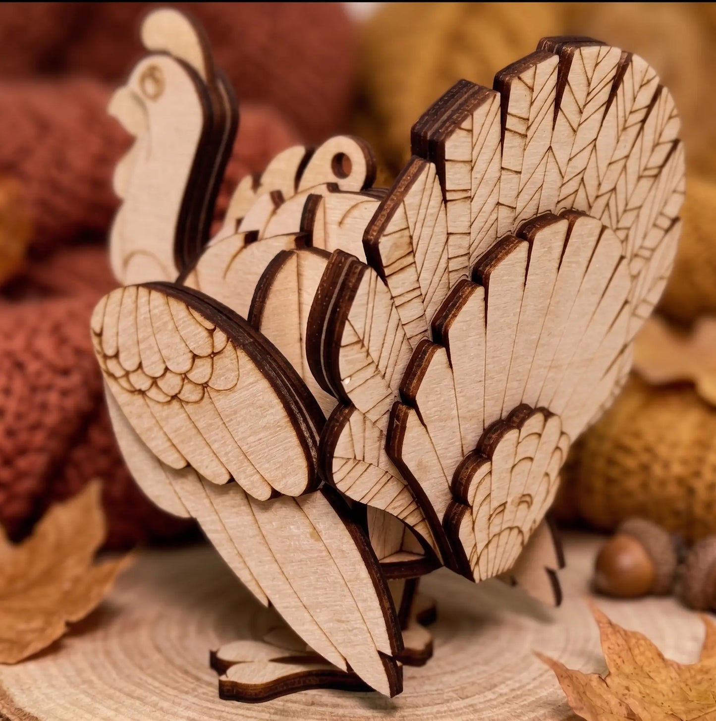 Wooden turkey ornament with intricate cut-out design on a rustic background