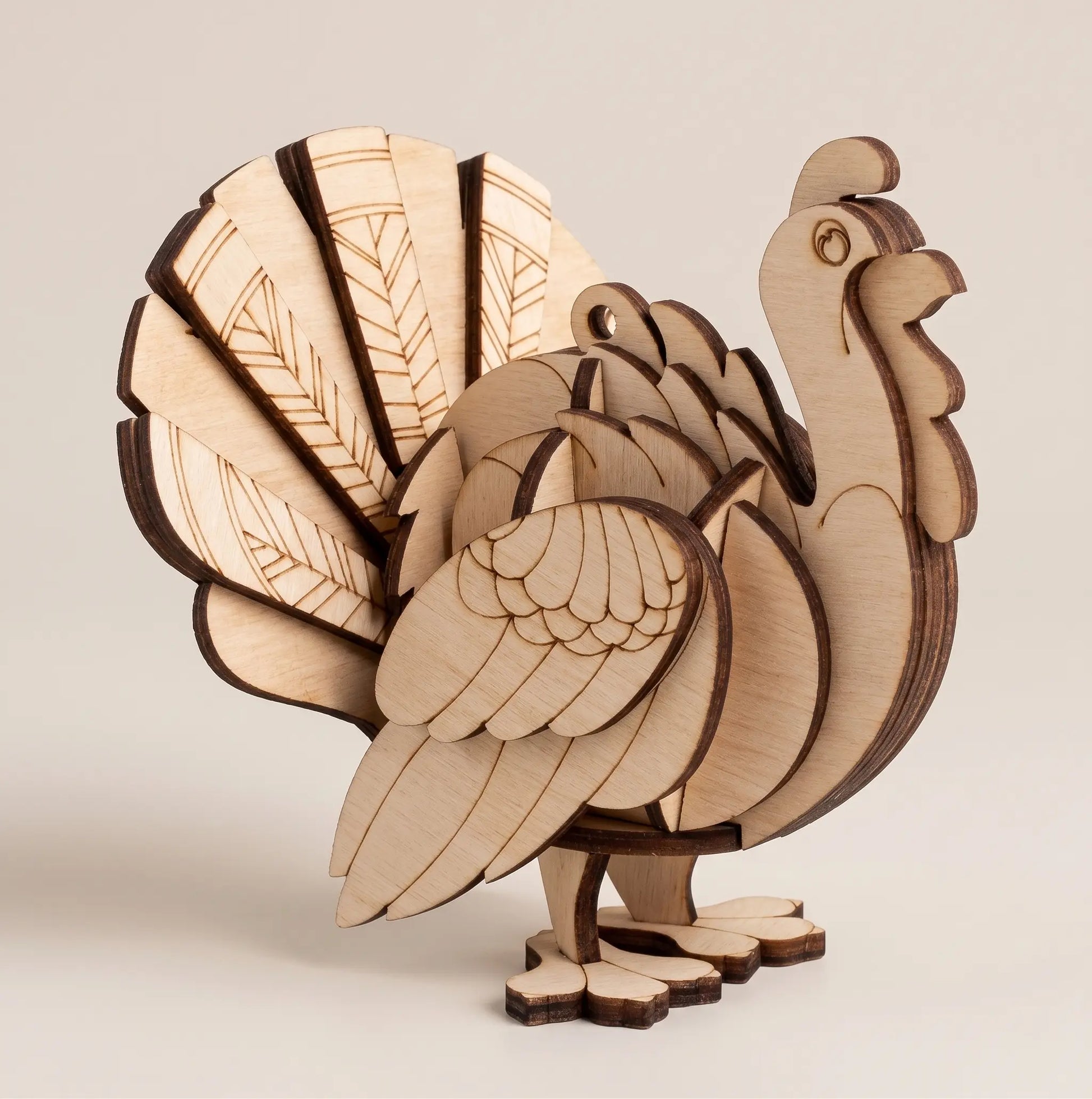 Wooden laser cut turkey decoration on a beige background
