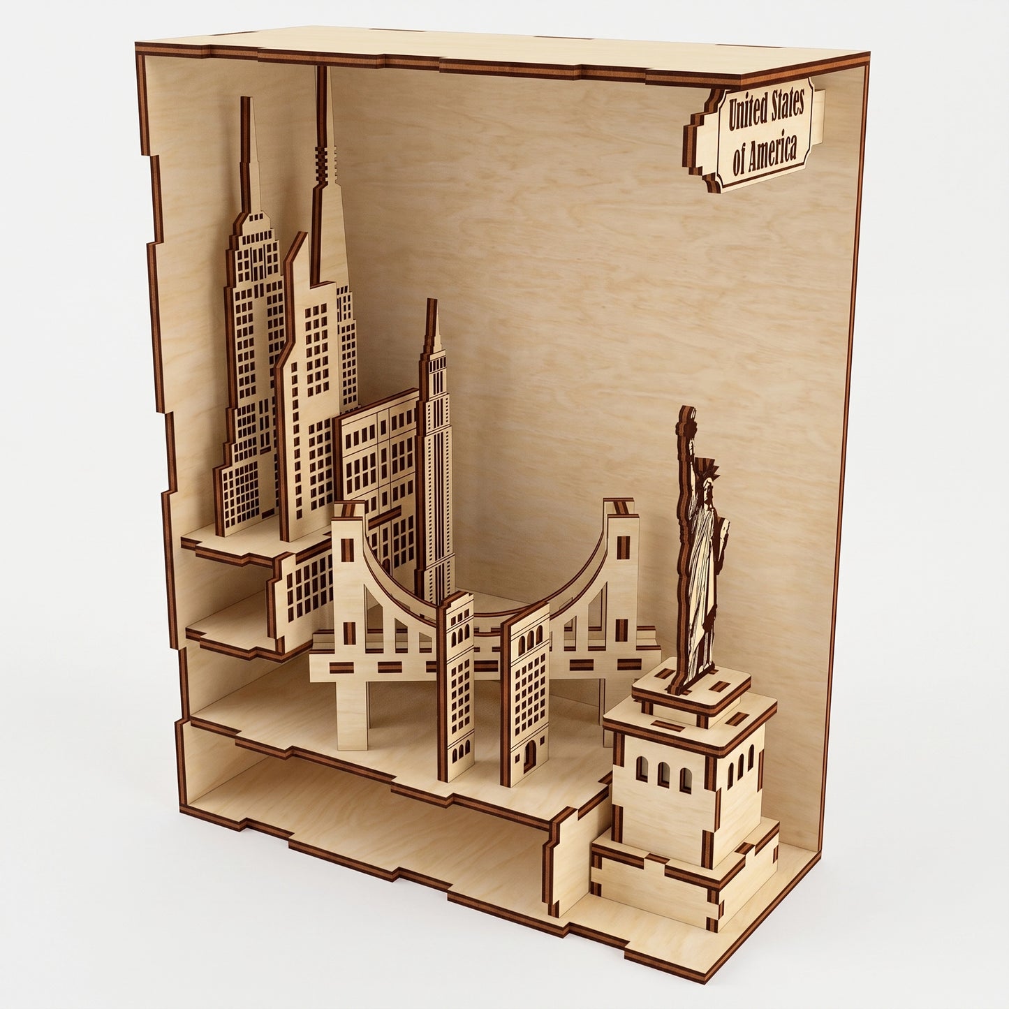 Open-view of a laser-cut birch plywood USA book nook showing architectural layers, the Statue of Liberty, and a top text sign.