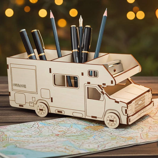 Wooden laser cut RV-shaped pencil holder with pens on a map