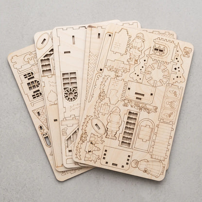 Multiple laser-cut plywood sheets created from compact SVG nesting layouts