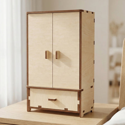 Large miniature wardrobe crafted from laser cut plywood. Features double doors with small wooden handles and a bottom drawer. Showcases the natural light wood grain and the characteristic dark edges of laser-cut designs.
