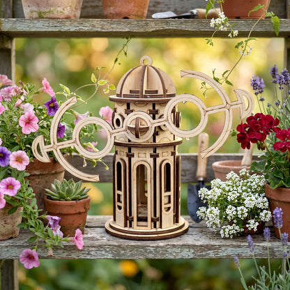 Wooden laser cut windmill with geometric design surrounded by potted plants outdoors
