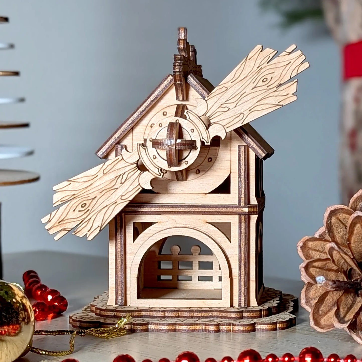 a rustic 3D laser cut miniature windmill facade with detailed engraving made of premium laser cut plywood.