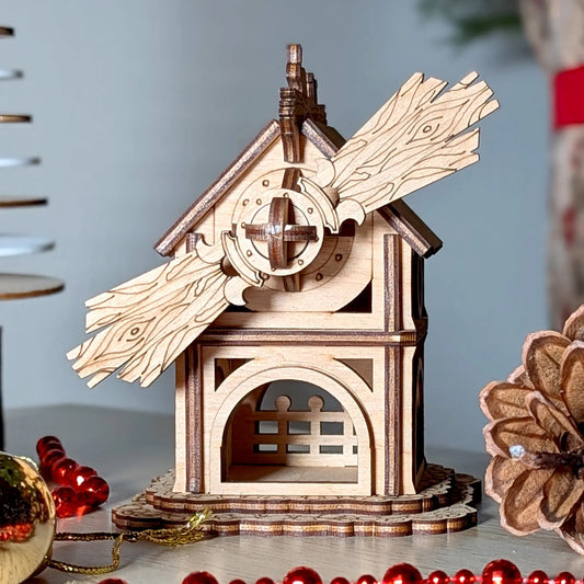Low-angle close shot of a rustic 3D miniature windmill facade with detailed engraving made of premium laser cut plywood.